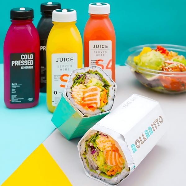 Two Rollrritto poke burritos, a poke bowl, and four colorful juice bottles on a vibrant background.